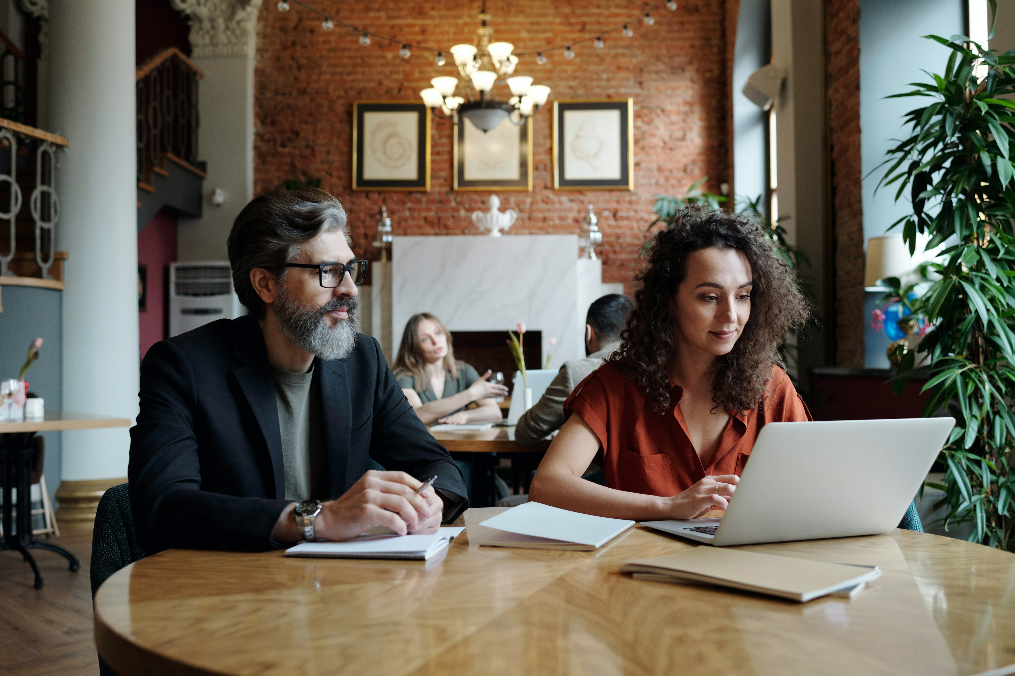 image of a man and a woman sitting at a desk